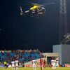 A police helicopter hovers over the pitch as Equitorial Guinea fans throw objects during the 2015 African Cup of Nations semi-final soccer match against Ghana in Malabo