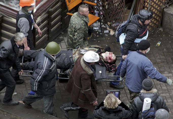 ATTENTION EDITORS - VISUAL COVERAGE OF SCENES OF INJURY OR DEATH - Anti-government protesters carry an injured man on a stretcher after violence erupted in the Independen