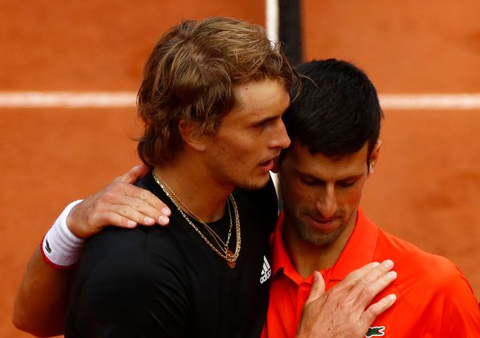 Tennis - French Open - Roland Garros, Paris, France - June 6, 2019. Germany's Alexander Zverev and Serbia's Novak Djokovic greet each other after their quarterfinal match