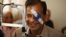 A man smiles during a routine eye check-up after his cataract surgery at the Tilganga Eye Center in Kathmandu April 27, 2012. About 150,000 of Nepal's 26.6 million people are estimated to be blind in both eyes, most of them with cataracts. Picture taken April 27, 2012. REUTERS/Navesh Chitrakar (NEPAL - Tags: HEALTH SOCIETY POVERTY) Published: Kvě. 2, 2012, 5:16 dop.