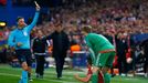 Bayern Munich's Manuel Neuer is shown a yellow card by referee Mark Clattenburg after this incident with Atletico Madrid's Koke