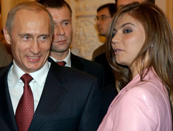 Ruský prezident Vladimir Putin a olympijská vítězka v gymnastice Alina Kabajevová.