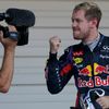 Red Bull Formula One driver Vettel of Germany gestures to a camera after winning the Japanese F1 Grand Prix at the Suzuka circuit