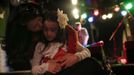 Mercedes Santos kisses her daughter Ava after her performance at the "Beat Kitchen" in Chicago, Illinois, February 24, 2013. Santos and her partner Theresa Volpe are a same-sex couple raising two of their biological children as they struggle to get same-sex marriages passed into law in Illinois. Picture taken February 24, 2013. REUTERS/Jim Young (UNITED STATES - Tags: SOCIETY) Published: Bře. 25, 2013, 6:06 odp.