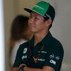 Caterham Formula One driver Kobayashi of Japan looks on in the garage during the second practice session of the Australian F1 Grand Prix in Melbourne