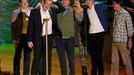 Writer John Green accepts the award for Movie of the Year for &quot;The Fault In Our Stars&quot; as the cast and crew look on at the 2015 MTV Movie Awards in Los Angeles