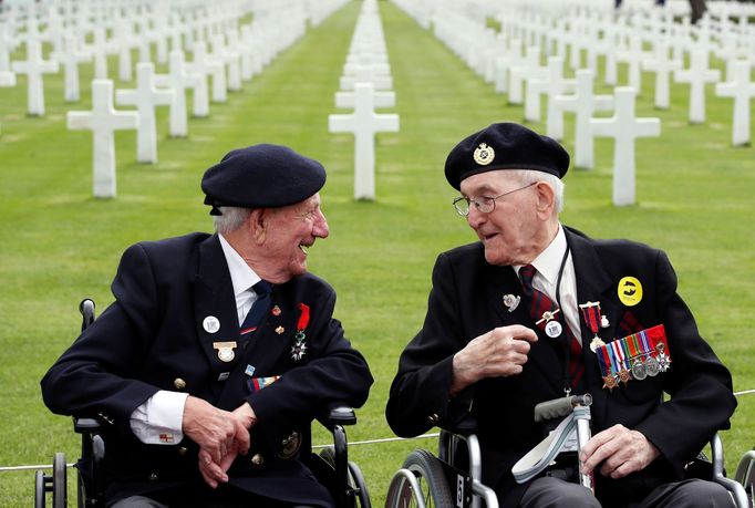 WWII veterans Richard Pelzer and George Chandler attend a ceremony at Normandy American Cemetery and Memorial situated above Omaha Beach