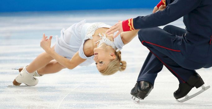 Tatiana Volosozhar and Maxim Trankov of Russia compete during the Team Pairs Short Program at the Sochi 2014 Winter Olympics