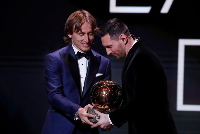 Soccer Football - The Ballon d’Or awards - Theatre du Chatelet, Paris, France - December 2, 2019  Real Madrid's Luka Modric and Barcelona's Lionel Messi with the Ballon d