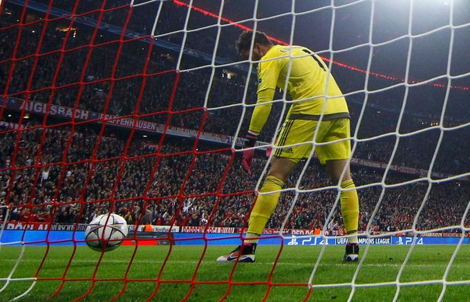 Benfica's goal keeper Ederson picks up ball following a goal by Bayern Munich's Arturo Vidal.