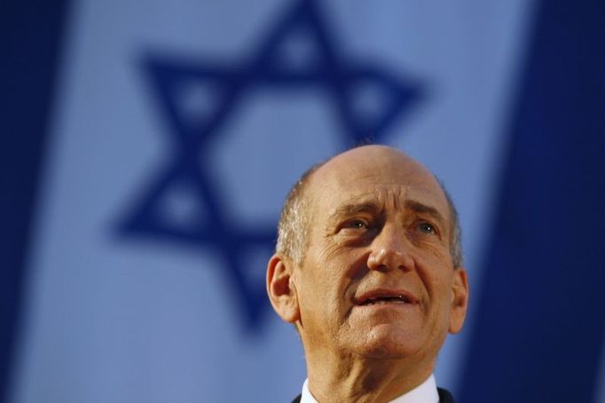 Israel's Prime Minister Ehud Olmert gives a speech during a graduation ceremony of the National Security College in Jerusalem July, 2008. Olmert said the Jewish state had resumed indirect talks with Syria in Turkey on Tuesday and called on Damascus to break with Iran in favour of a broader peace. REUTERS/Baz Ratner (JERUSALEM)