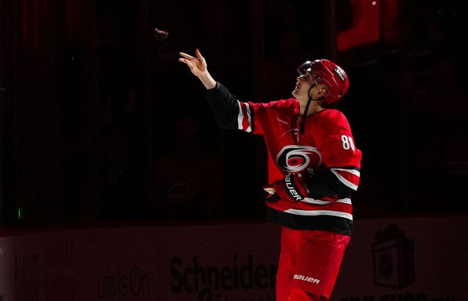 Dec 5, 2024; Raleigh, North Carolina, USA;  Carolina Hurricanes center Martin Necas (88) tosses a puck into the stands after their victory against the Colorado Avalanche