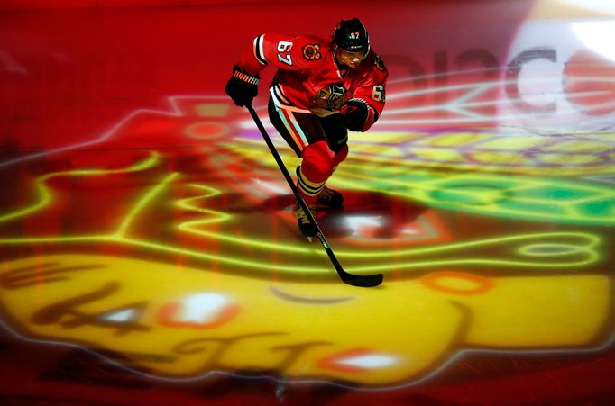 Chicago Blackhawks center Michael Frolik skates out onto the ice and over his teams logo before the start of Game 1 of the NHL Western Conference semifinals against the D