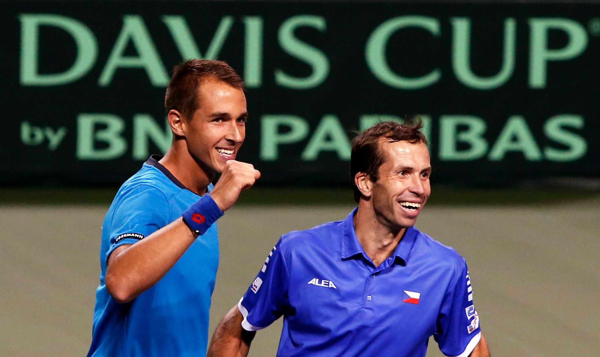 Rosol and Stepanek of Czech Republic celebrate after winning their Davis Cup quarter-final men's doubles tennis match against Japan's Ito and Uchiyama in Tokyo