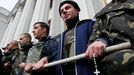 Members of a &quot;Maidan&quot; self-defence unit stand guard in front of the Ukrainian parliament building in Kiev April 15, 2014.