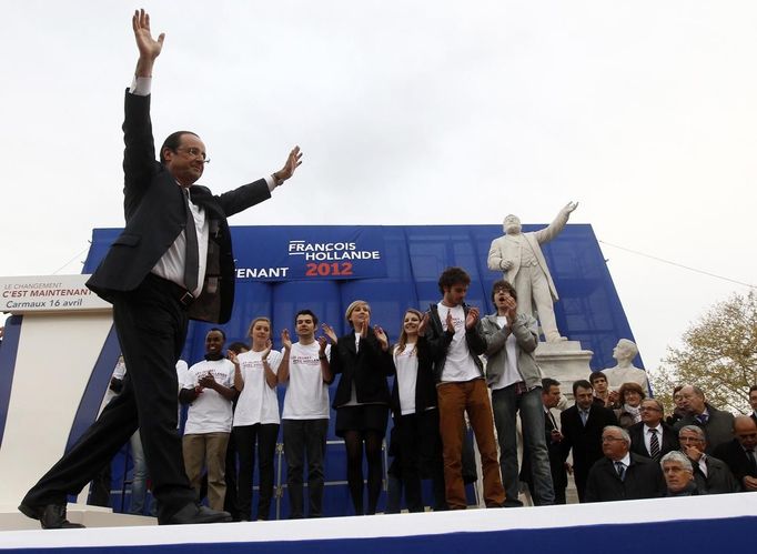 Hollande, Socialist Party candidate for the 2012 French presidential elections, waves during his campaign trip in Carmaux