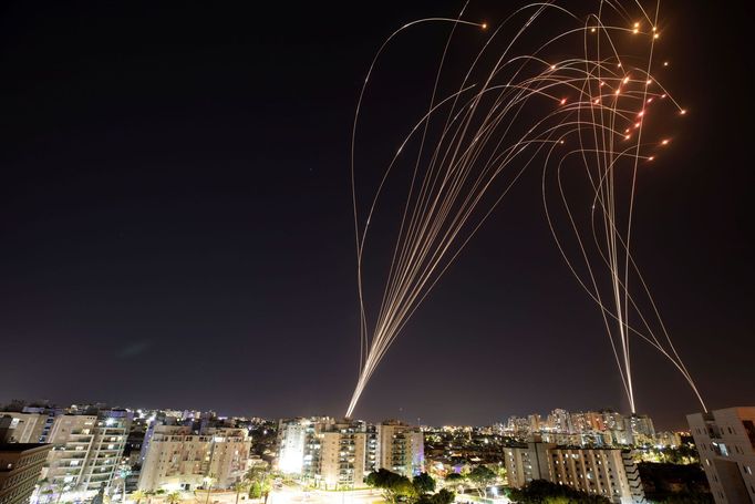 Streaks of light are seen as Israel's Iron Dome anti-missile system intercepts rockets launched from the Gaza Strip towards Israel, as seen from Ashkelon, Israel, May 11,