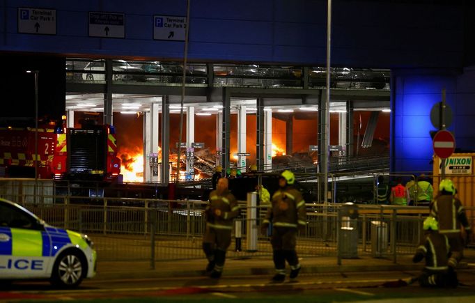 Flames are seen as emergency services respond to a fire in Terminal Car Park 2 at London Luton airport in Luton, Britain, October 10, 2023.  REUTERS/Peter Cziborra