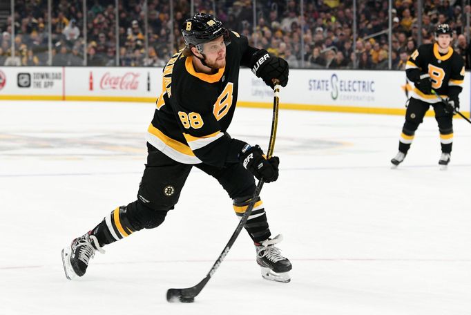 Feb 8, 2020; Boston, Massachusetts, USA; Boston Bruins right wing David Pastrňák (88) takes a shot against the Arizona Coyotes during the first period at the TD Garden. M