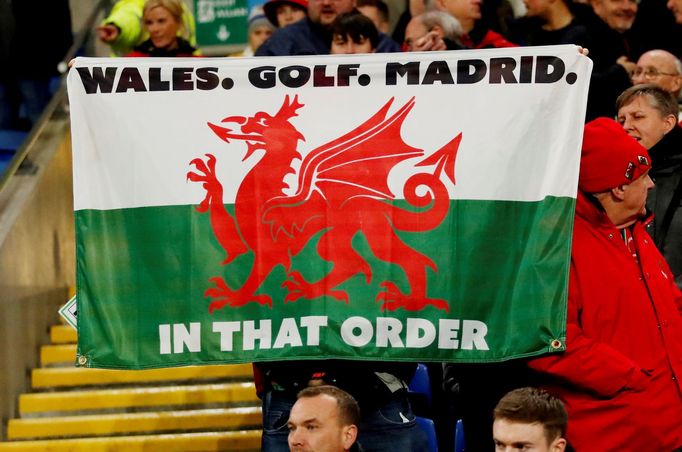 FILE PHOTO: Soccer Football - Euro 2020 Qualifier - Group E - Wales v Hungary - Cardiff City Stadium, Cardiff, Wales, Britain - November 19, 2019  Fans display a Wales fl