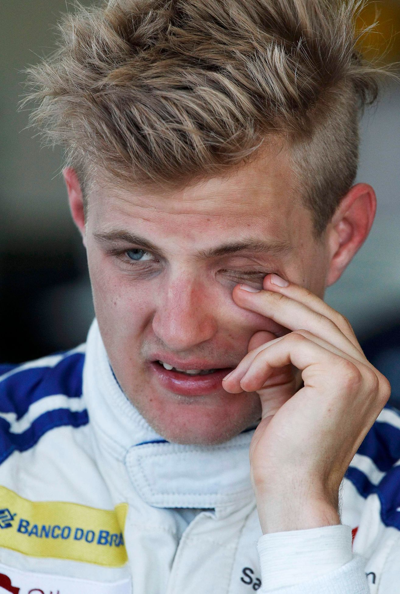 Sauber Formula One driver Marcus Ericsson of Sweden rubs his eye during the second practice session of the Australian F1 Grand Prix at the Albert Park circuit in Melbourne
