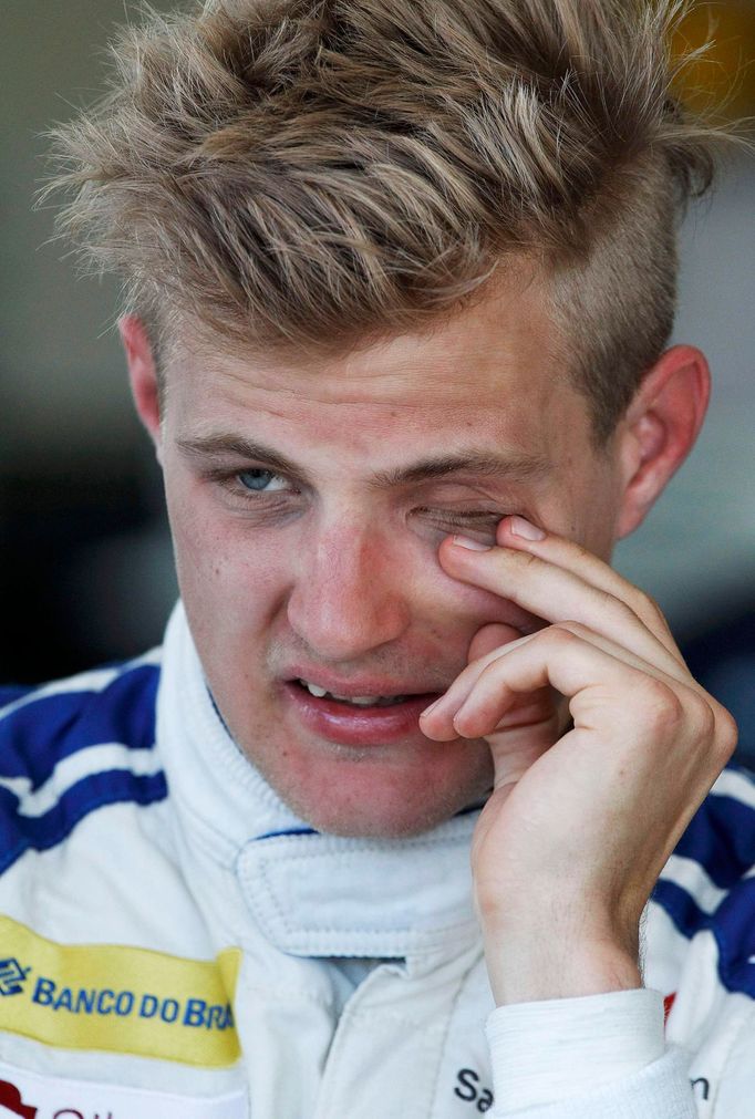 Sauber Formula One driver Marcus Ericsson of Sweden rubs his eye during the second practice session of the Australian F1 Grand Prix at the Albert Park circuit in Melbourn