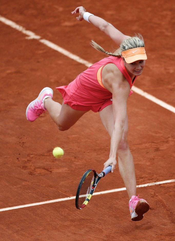 Eugenie Bouchard of Canada returns the ball to Angelique Kerber of Germany during their women's singles match at the French Open tennis tournament at the Roland Garros st