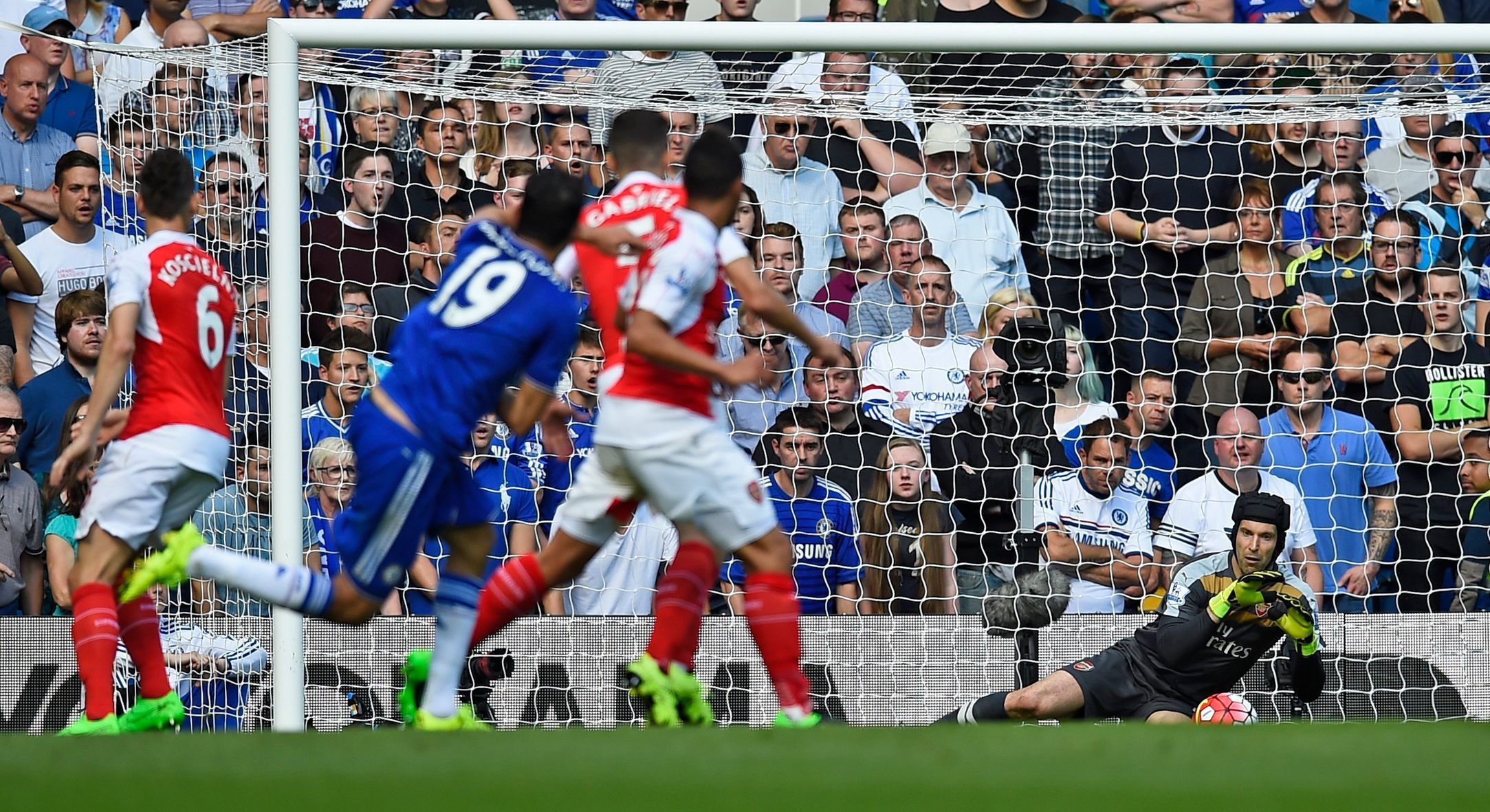 Arsenal's Petr Cech saves a shot from Chelsea's Diego Costa