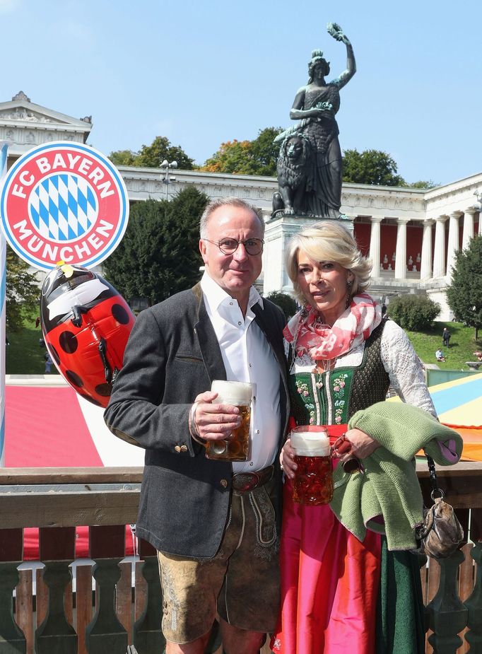 FC Bayern Munich's CEO Bayern Muenchen Rummenigge and his wife Martina pose during their visit at the Oktoberfest in Munich