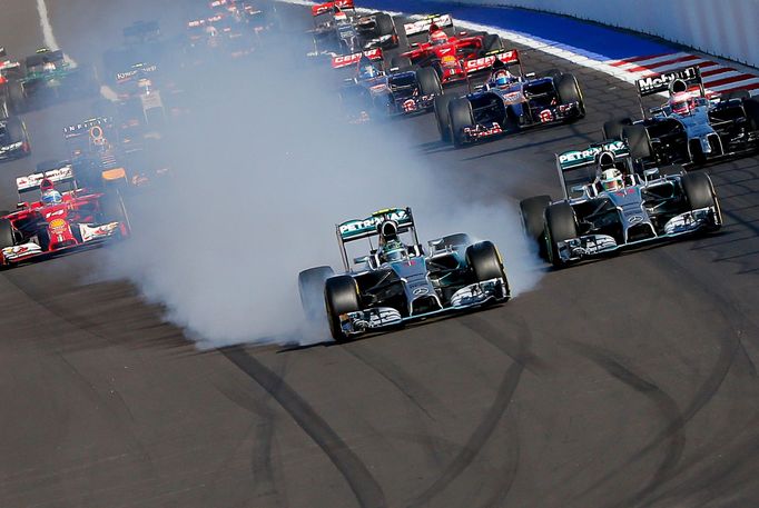 Mercedes Formula One driver Nico Rosberg of Germany leads next to Mercedes Formula One driver Lewis Hamilton of Britain (R) after the start of the first Russian Grand Pri