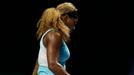 Serena Williams of the U.S. walks off the court with her second broken racquet during her WTA Finals singles semi-finals tennis match against Caroline Wozniacki of Denmar