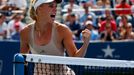 Caroline Wozniacki of Denmark celebrates a point against Maria Sharpova of Russia during their match at the 2014 U.S. Open tennis tournament in New York