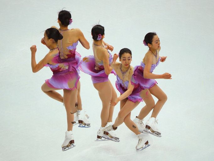 Mao Asada of Japan competes during the figure skating team ladies short program at the Sochi 2014 Winter Olympics, February 8, 2014. Picture taken with multiple exposure.