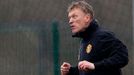 Manchester United's manager Moyes heads a ball during a training session at the clu