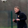 Manchester United's manager Moyes heads a ball during a training session at the club's Carrington training complex in Manchester