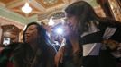 Theresa Volpe (C) and her partner Mercedes Santos (L) wait for the start of an an Illinois Senate Executive Committee hearing on same-sex marriages with their daughter Ava at the State Legislature in Springfield, Illinois, January 3, 2013. Picture taken on January 3, 2013. REUTERS/Jim Young (UNITED STATES - Tags: SOCIETY) Published: Bře. 25, 2013, 6:07 odp.