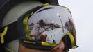 The half pipe is reflected in the goggles of an unidentified athlete at the Extreme Park, a Sochi 2014 Winter Olympics venue for the snowboard and skiing freestyle events in Rosa Khutor near Sochi February 12, 2013. Although many complexes and venues in the Black Sea resort of Sochi mostly resemble building sites that are still under construction, there is nothing to suggest any concern over readiness. Construction will be completed by August 2013 according to organizers. The Sochi 2014 Winter Olympics opens on February 7, 2014. REUTERS/Kai Pfaffenbach (RUSSIA - Tags: BUSINESS CONSTRUCTION CITYSPACE ENVIRONMENT SPORT OLYMPICS) Published: Úno. 12, 2013, 11:15 dop.