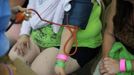 A patient has her blood pressure taken before receiving treatment at the Remote Area Medical (RAM) clinic in Wise, Virginia July 20, 2012. RAM clinics bring free medical, dental and vision care to uninsured and under-insured people across the country and abroad. The Wise clinic was the 647th RAM expedition since 1985 and drew 1700 patients from 14 states, organizers said. Picture taken July 20, 2012. REUTERS/Mark Makela (UNITED STATES - Tags: HEALTH SOCIETY) Published: Čec. 24, 2012, 3:03 odp.