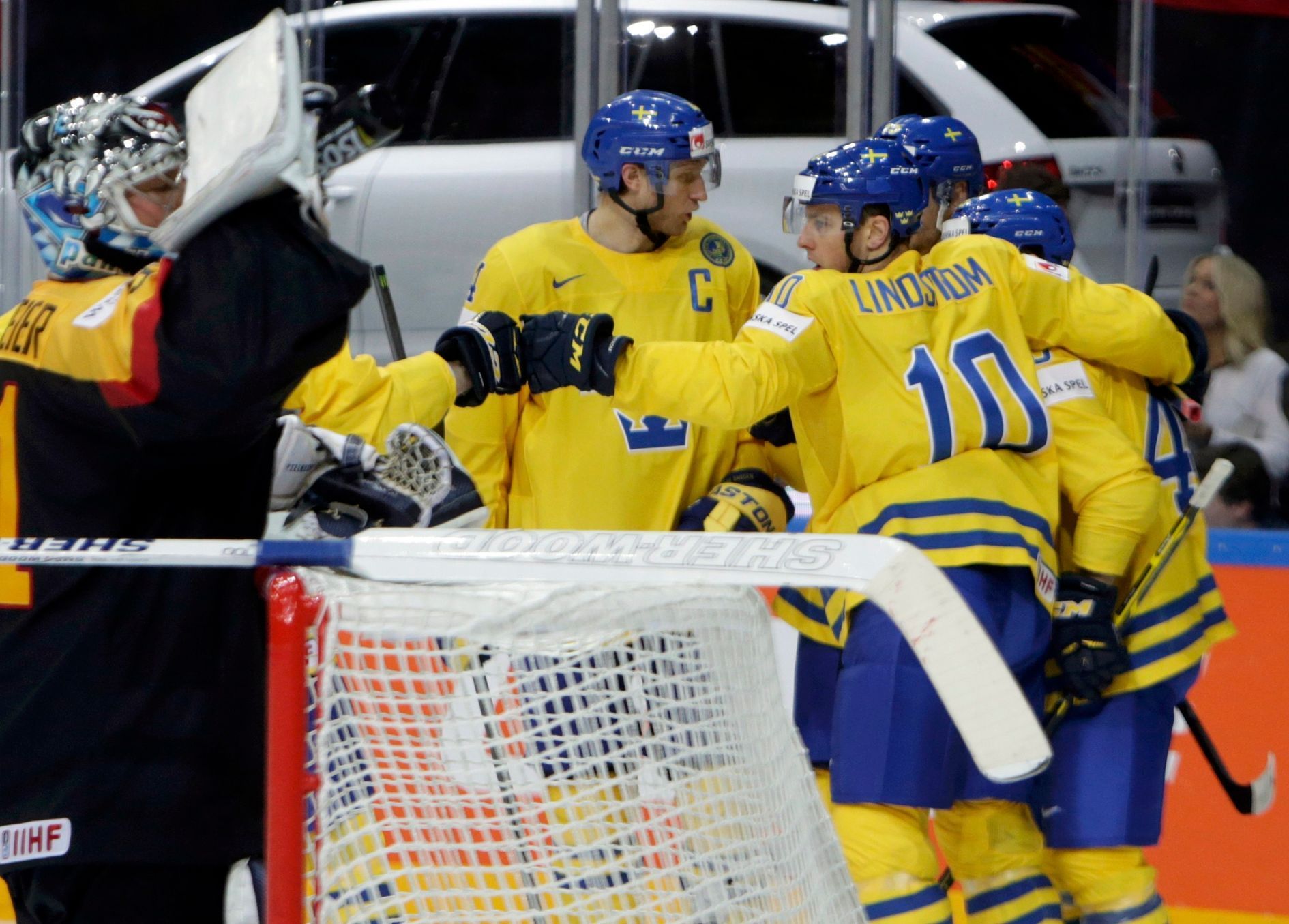 Sweden's Moller celebrates scoring a goal with team mates during their Ice Hockey World Championship game against Germany in Prague