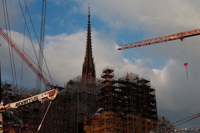 The spire, surmounted by the rooster and the cross, of the Notre-Dame de Paris Cathedral, which was ravaged by a fire in 2019, is pictured as restoration works continue i