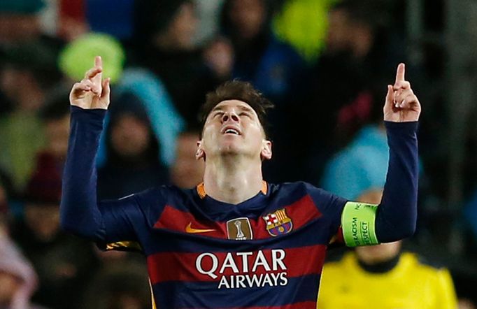 Lionel Messi celebrates scoring the third goal for Barcelona