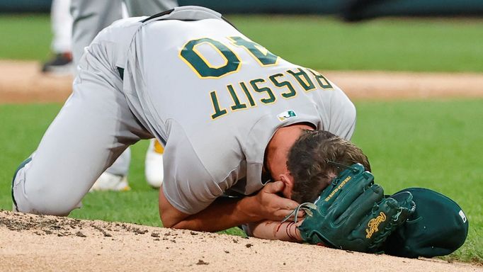 FILE PHOTO: Aug 17, 2021; Chicago, Illinois, USA; (EDITORS NOTE: graphic content) Oakland Athletics starting pitcher Chris Bassitt (40) covers his face after being hit by