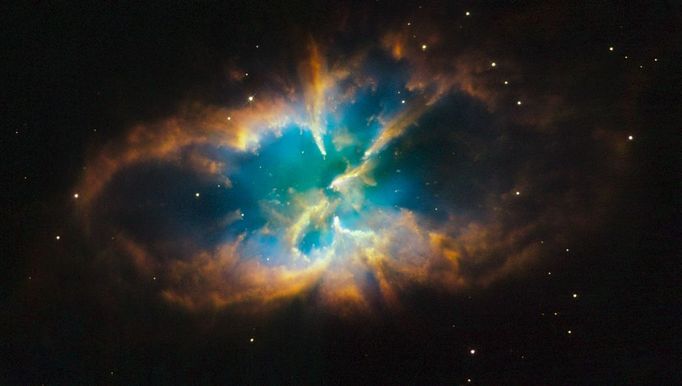 The unique planetary nebula NGC 2818 is nested inside the open star cluster NGC 2818A. Both the cluster and the nebula reside over 10,000 light-years away, in the southern constellation Pyxis (the Compass).