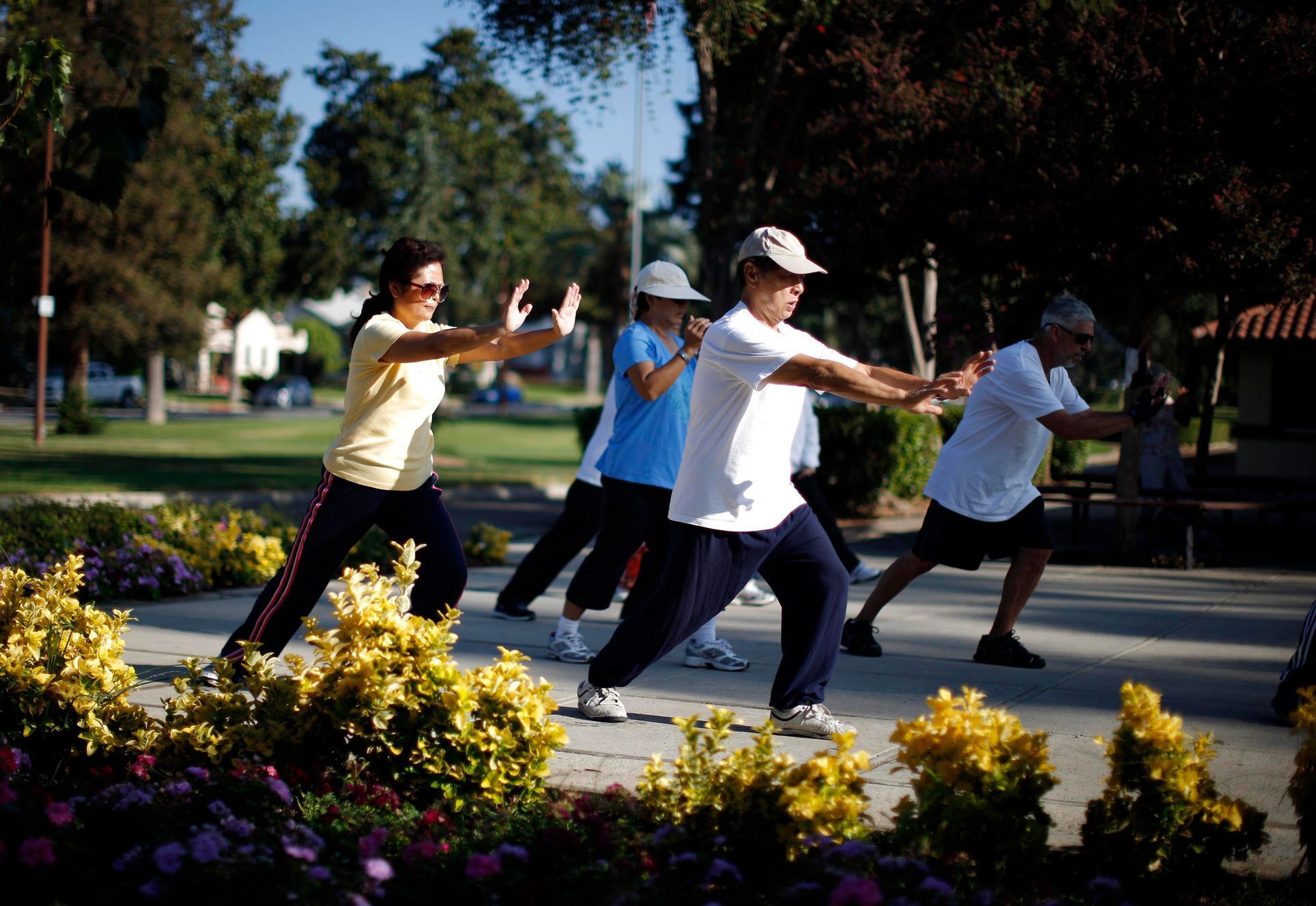Johney Yu and Diana Yang, both immigrants from China, practice tai chi at a daily class in Alhambra