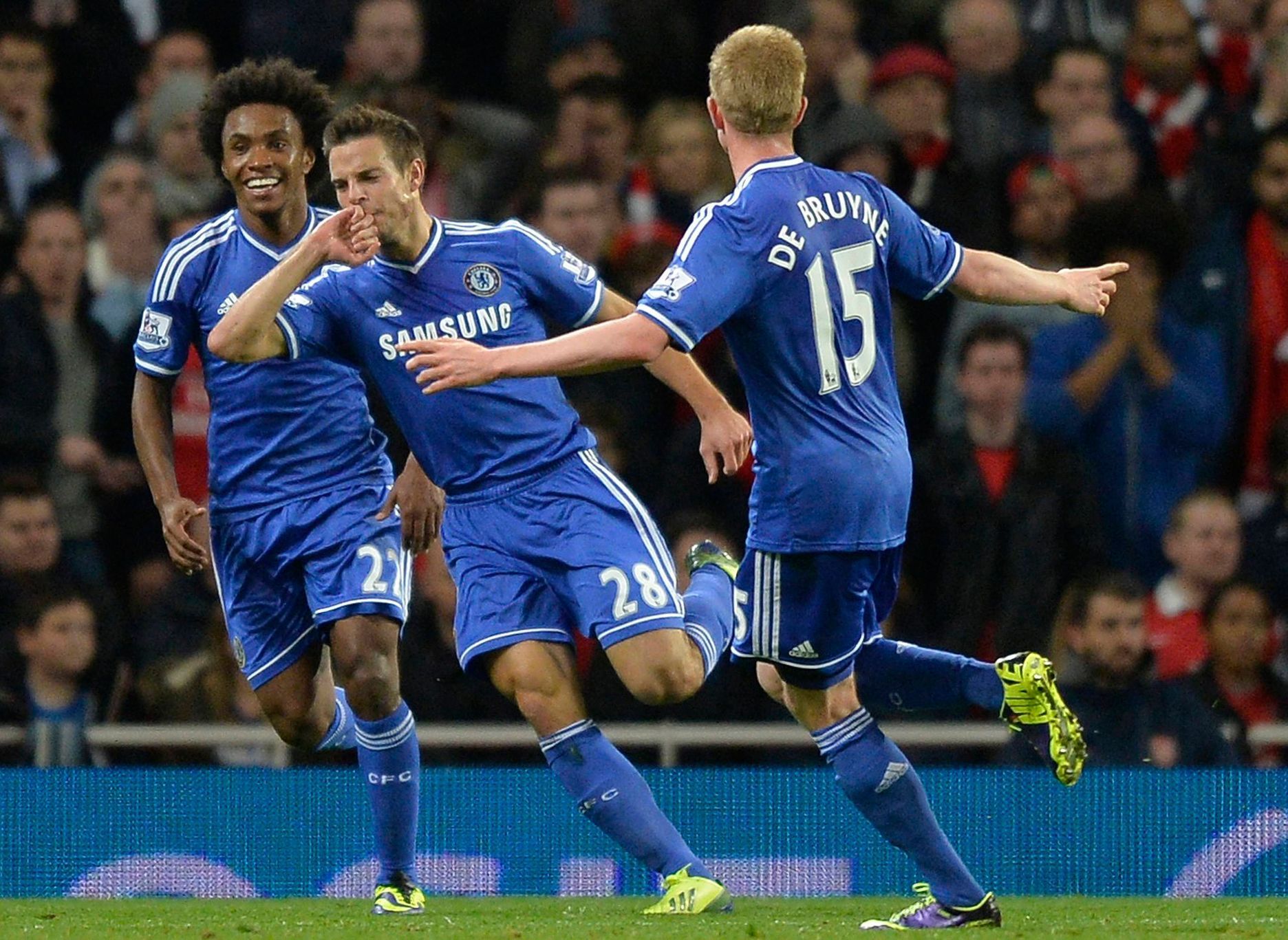 Chelsea's Azpilicueta celebrates scoring with Willian  and De Bruyne during their English League Cup fourth round soccer match against Arsenal at Emirates Stadium in London