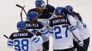 Finland's Juuso Hietanen (L) celebrates scoring a goal against Canada during the third period of their men's ice hockey World Championship quarter-final game at Chizhovka