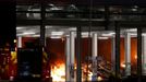 Flames are seen as emergency services respond to a fire in Terminal Car Park 2 at London Luton airport in Luton, Britain, October 10, 2023.  REUTERS/Peter Cziborra