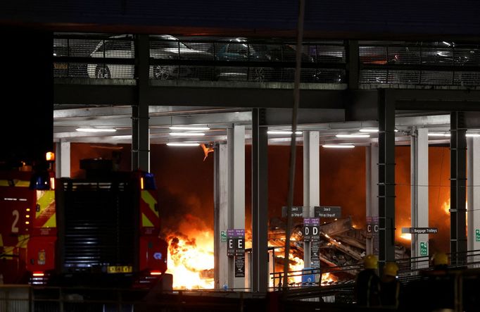 Flames are seen as emergency services respond to a fire in Terminal Car Park 2 at London Luton airport in Luton, Britain, October 10, 2023.  REUTERS/Peter Cziborra