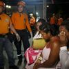 Rescue team members and patients react outside a clinic that was evacuated after tremors were felt resulting from an earthquake in Ecuador, in Cali, Colombia