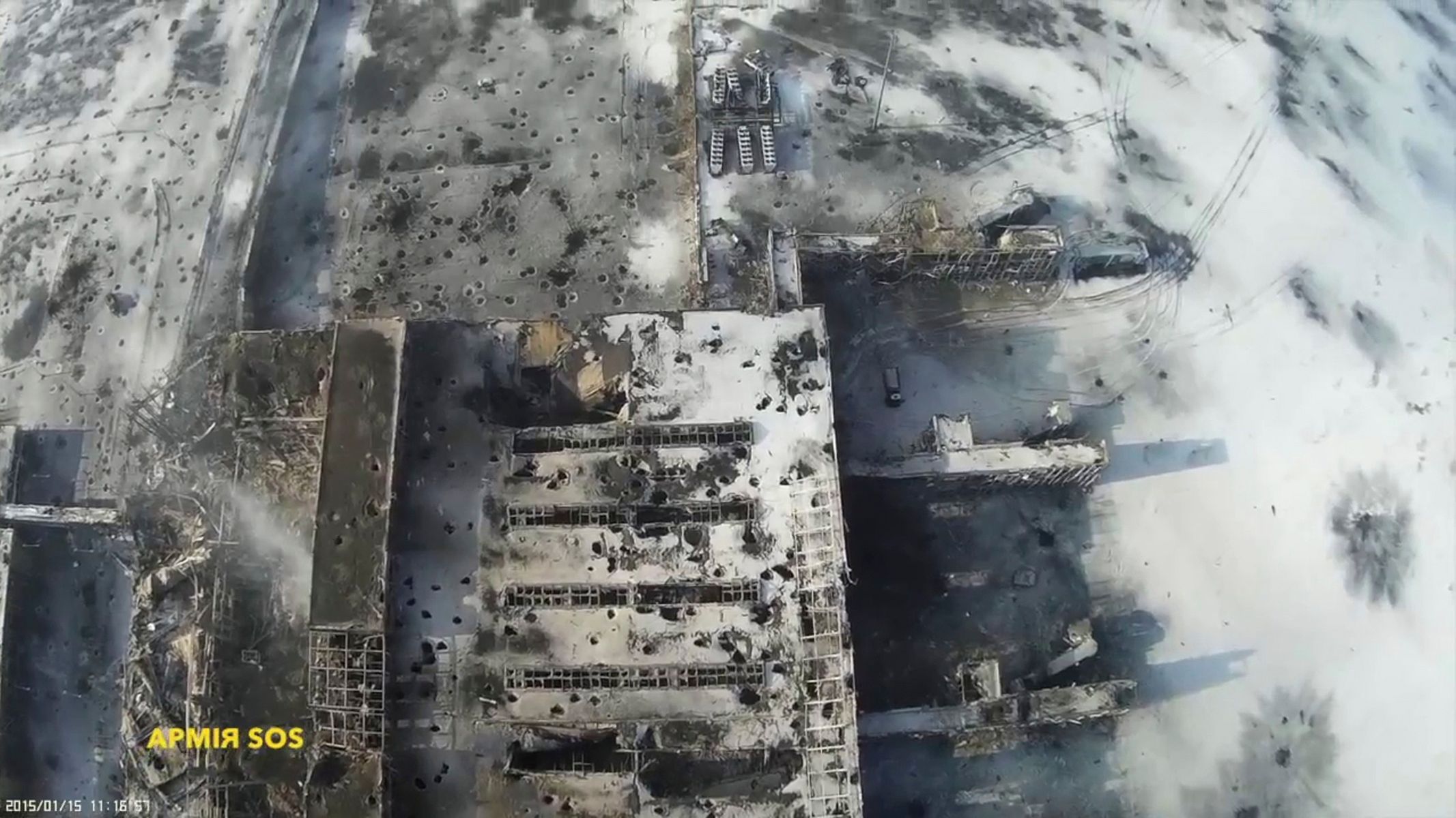 Still image taken from handout aerial footage shot by a drone, shows the terminal building of the Sergey Prokofiev International Airport damaged by shelling during fighting between pro-Russian separat